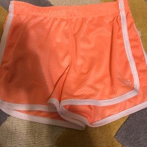 Justice athletic neon orange shorts